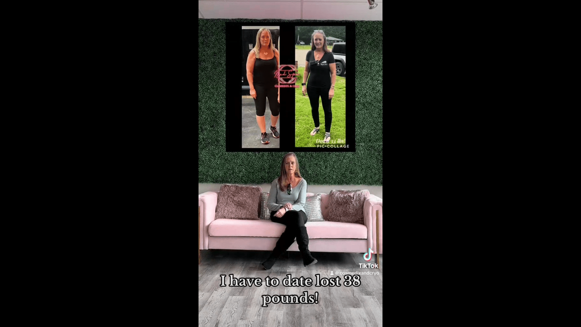 A woman sitting on the couch in front of a large picture.